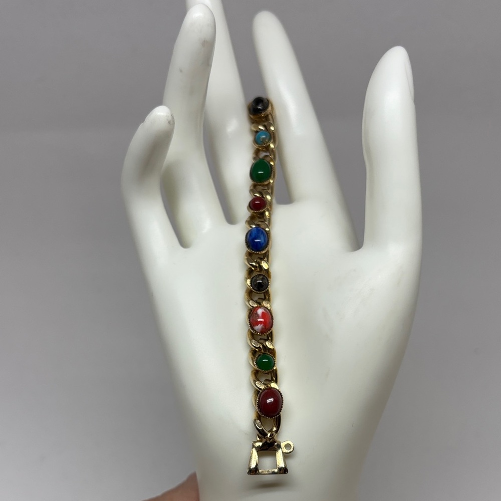 Gold tone bracelet with glass cabochons